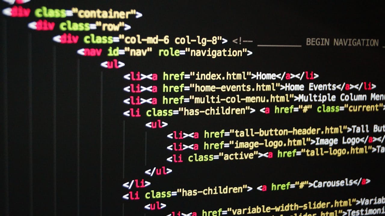 creative-01 Close-up of vibrant HTML code displayed on a computer screen, showcasing web development and programming.