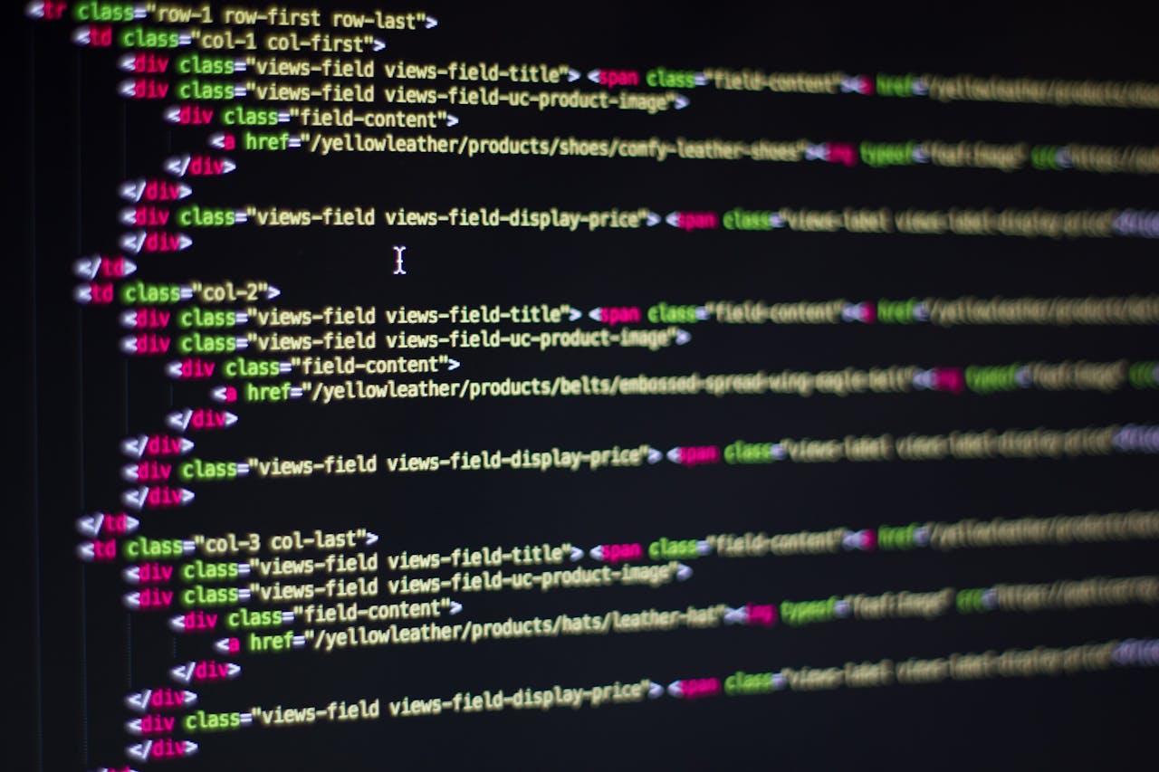 our-story Detailed close-up of HTML code on a computer monitor, showcasing web development.