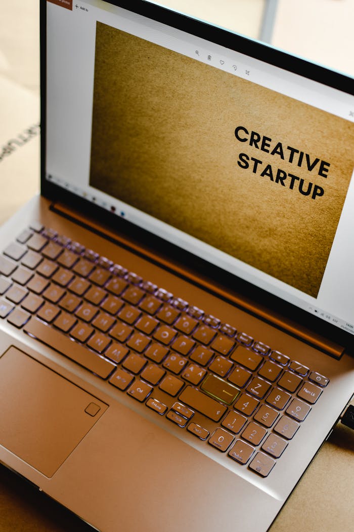 digital-01 Laptop displaying 'Creative Startup' concept in an inspiring workspace.